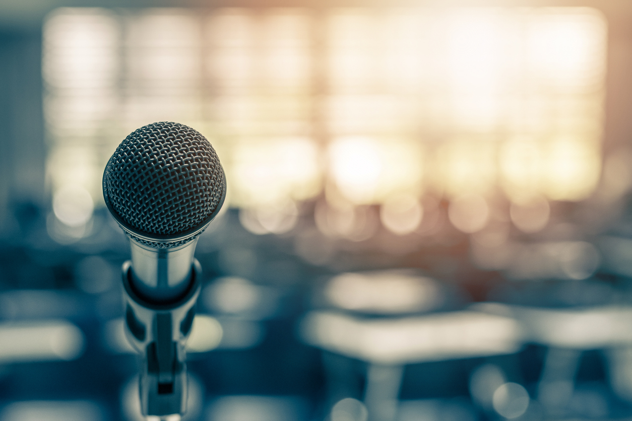 Close up of a microphone with a blurred background.