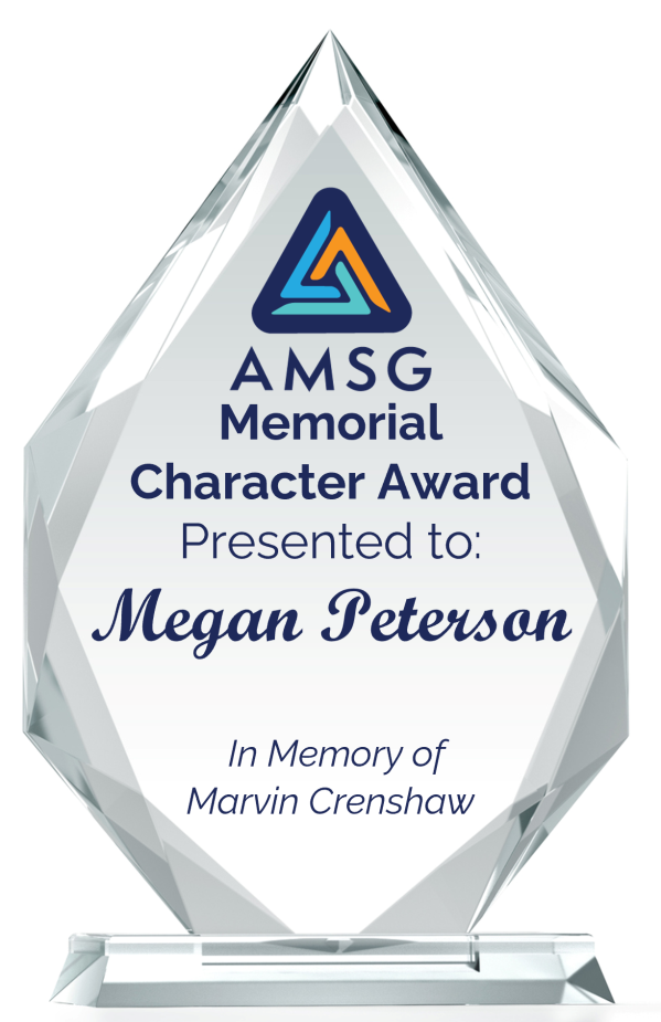 A crystal-clear trophy with the AMSG logo and text reading, "AMSG Memorial Character Award Presented to Megan Peterson. In Memory of Marvin Crenshaw," on a rectangular base.