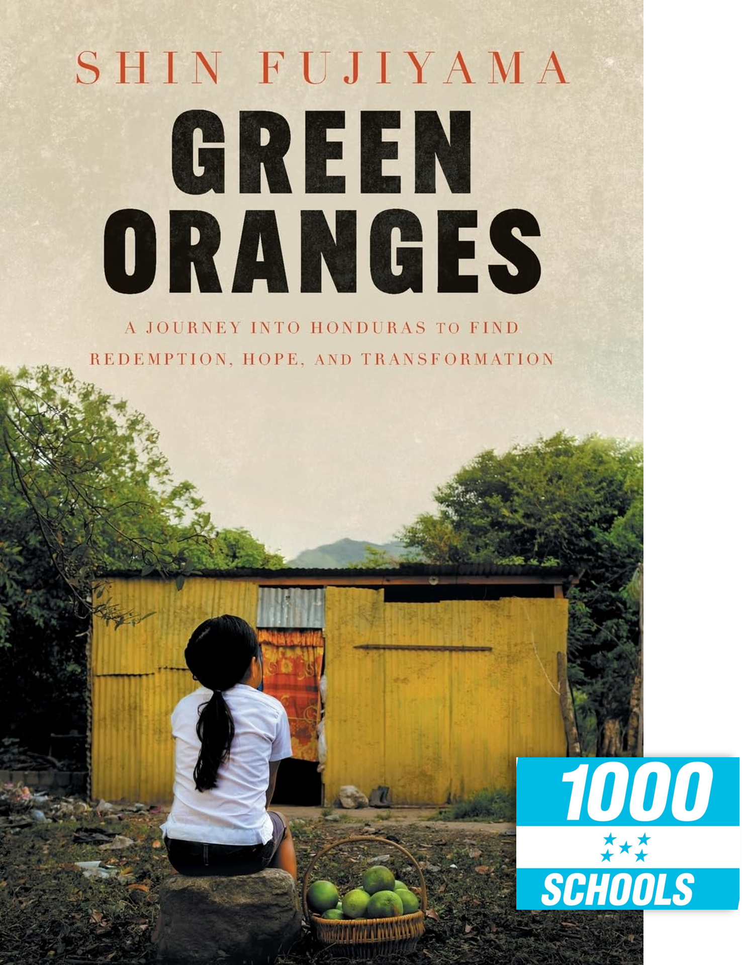 Book cover for "Green Oranges" by Shin Fujiyama, featuring a photo of a young girl with her back to the camera, sitting in front of a yellow metal house. The title and author are at the top, and a "1000 Schools" logo is at the bottom right.